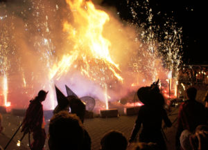 Walpurgisnacht in modern day Erfurt, Germany. Festival with masked persons around fire.