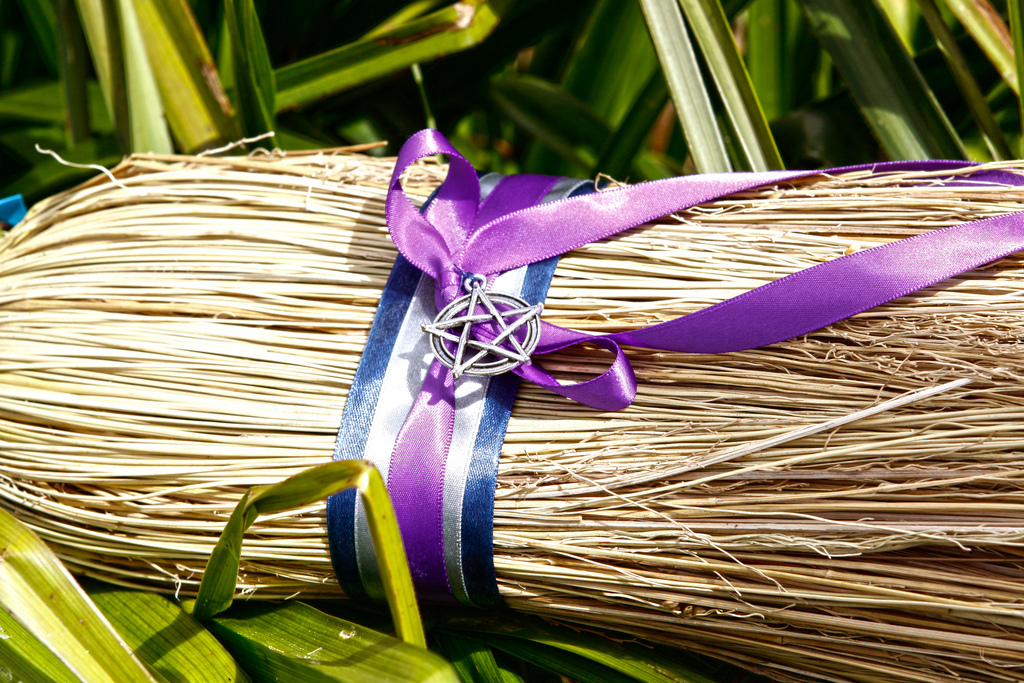 Magic witch's broom - decorated with pentagram and colored ribbons. Wicca broom / besom for witchcraft and sabbath. 